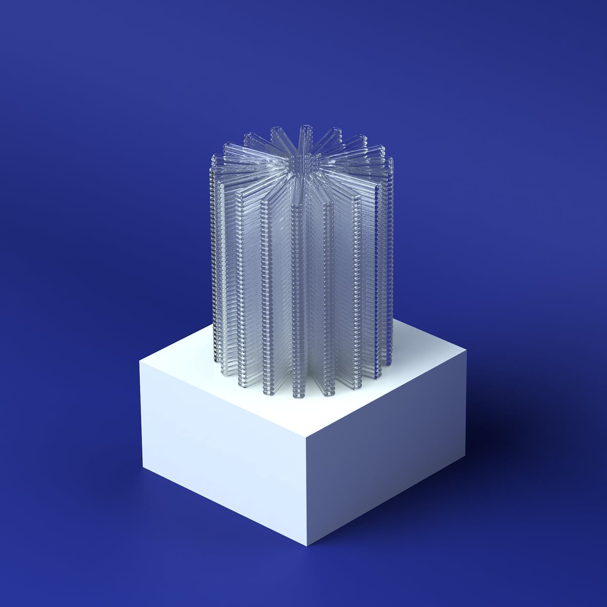 Clear acrylic radial star-stack on white block on a deep blue background